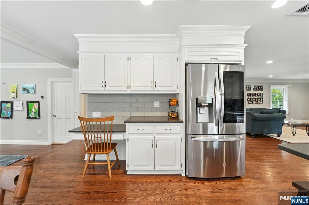 856 Stonewall Court Franklin Lakes, NJ 07417 - Photo 8 of 26 a kitchen with kitchen island white cabinets and stainless steel appliances