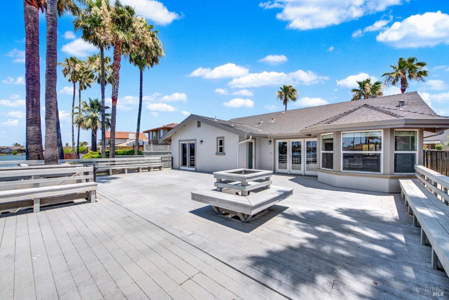 1270 Willow Lake Road Discovery Bay, CA 94505 - Photo 8 of 29 a outdoor space with lots of white furniture and a fire pit