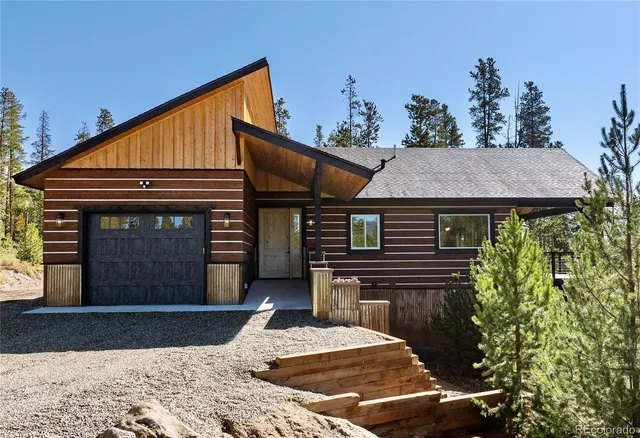 a view of a house with backyard porch and sitting area
