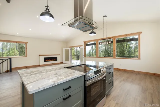 a kitchen with a stove and a sink