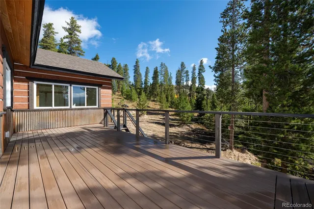 a view of a door and wooden floor
