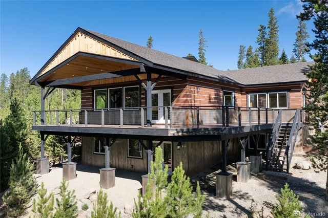 a house view with a seating space and garden
