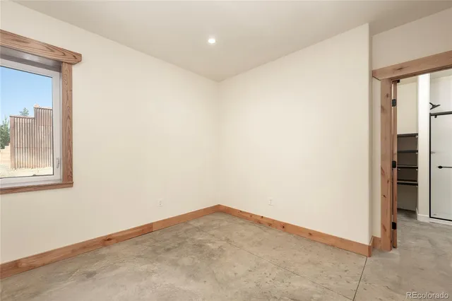 an empty room with closet area