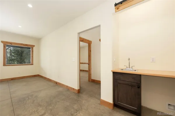 a view of a porch with wooden floor and outdoor space