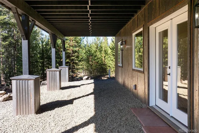 a view of a house with wooden fence