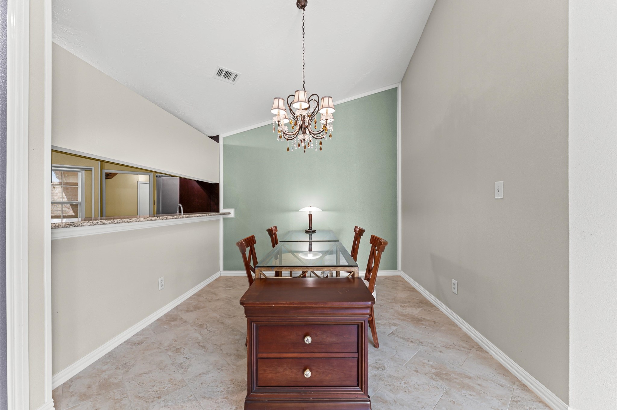17015 Sky Blue Place Houston, TX 77095 - Photo 19 of 25 a view of a dining room with furniture and chandelier