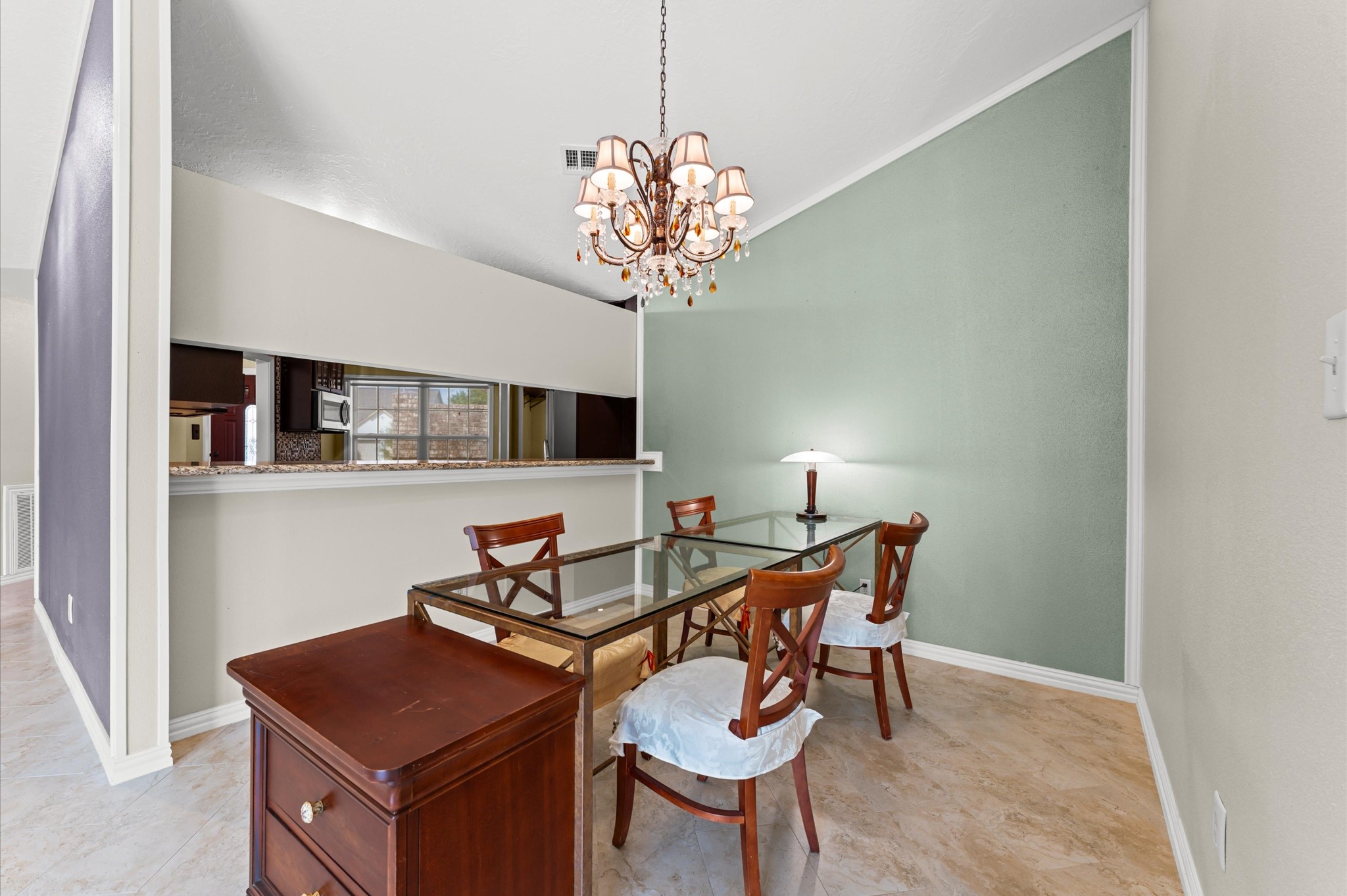 17015 Sky Blue Place Houston, TX 77095 - Photo 20 of 25 a view of a dining room with furniture and chandelier