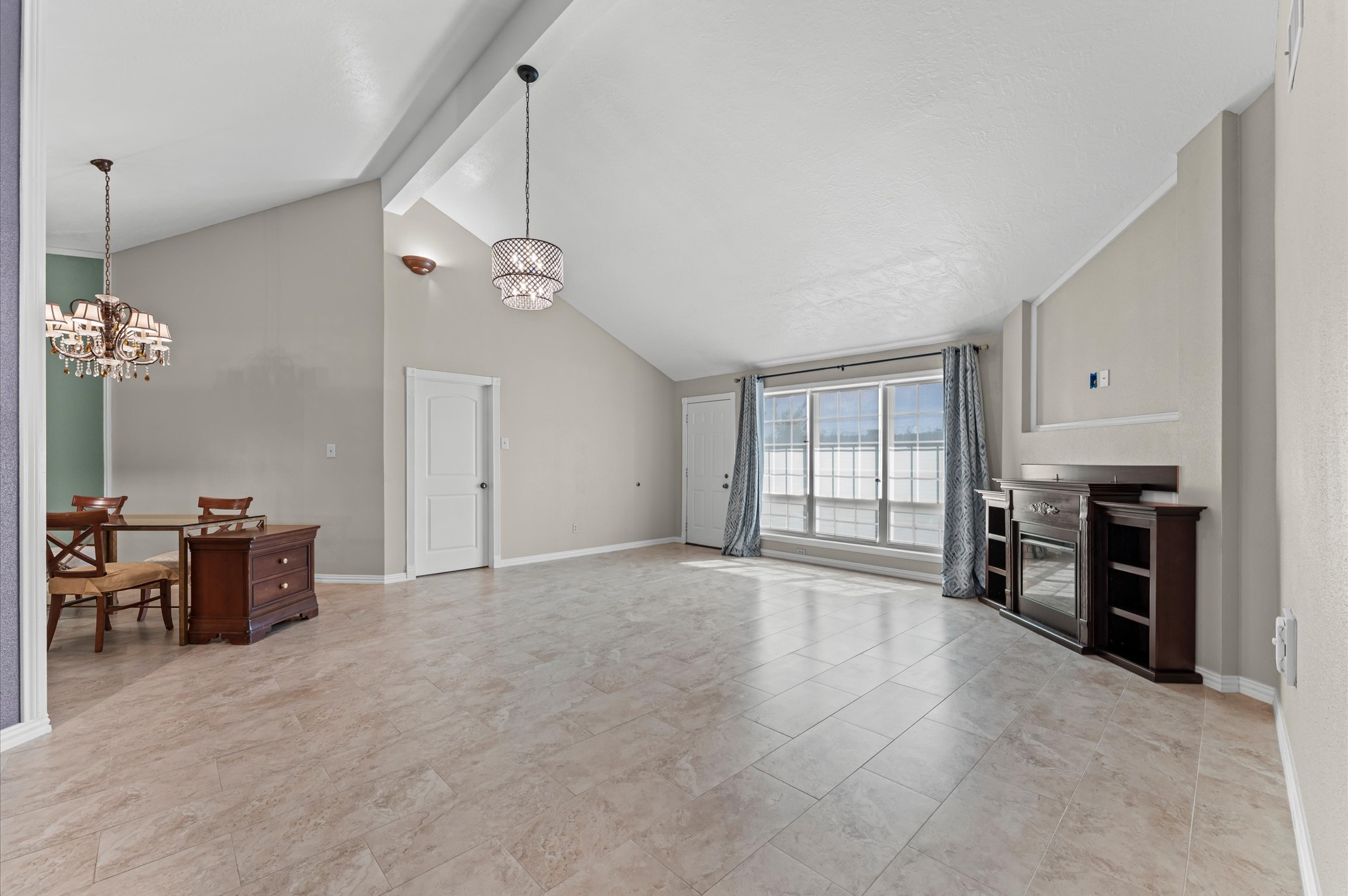 17015 Sky Blue Place Houston, TX 77095 - Photo 4 of 25 an empty room with windows and cabinet