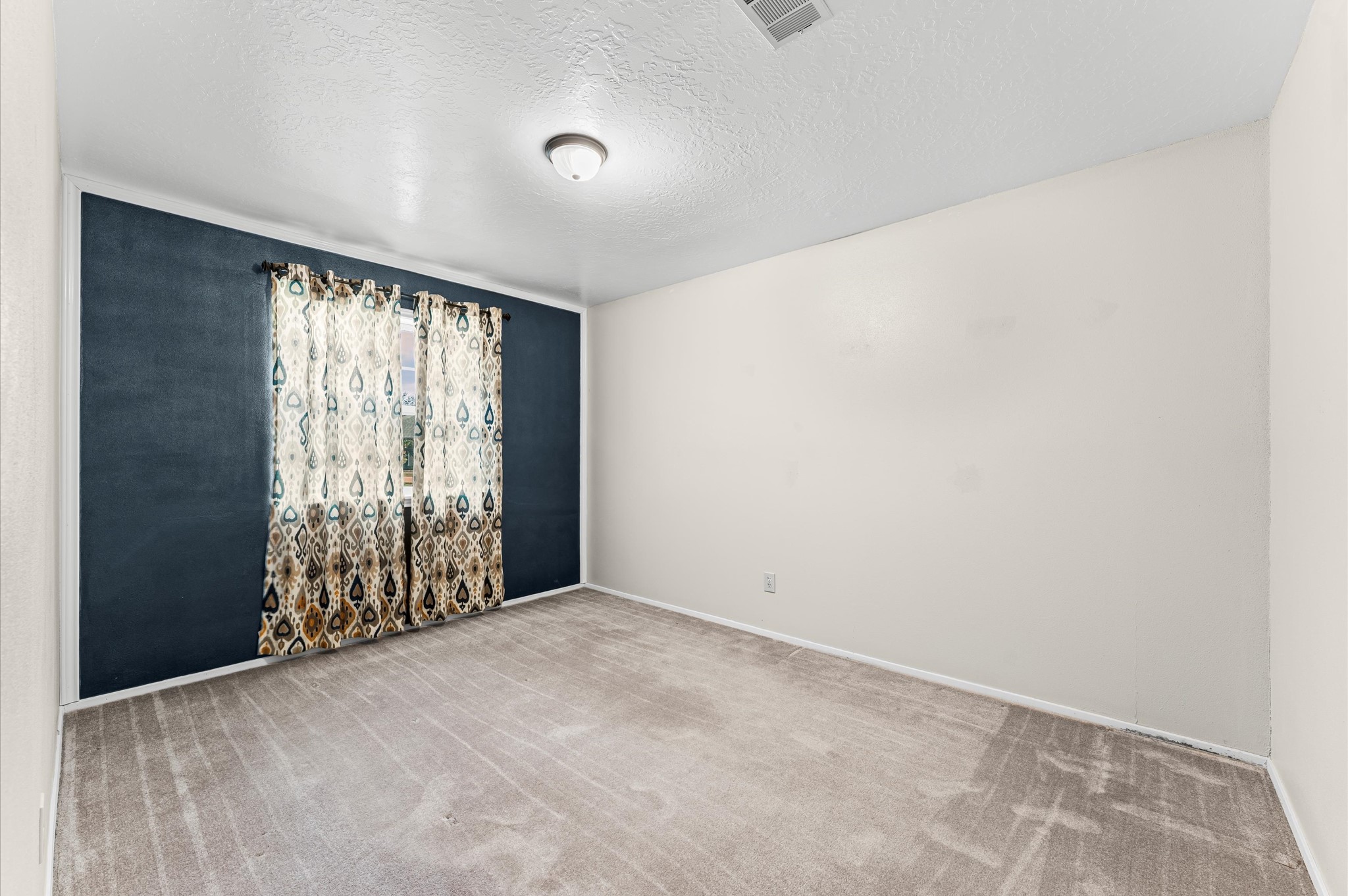 17015 Sky Blue Place Houston, TX 77095 - Photo 9 of 25 an empty room with windows
