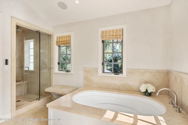 a bath tub sitting next to a window