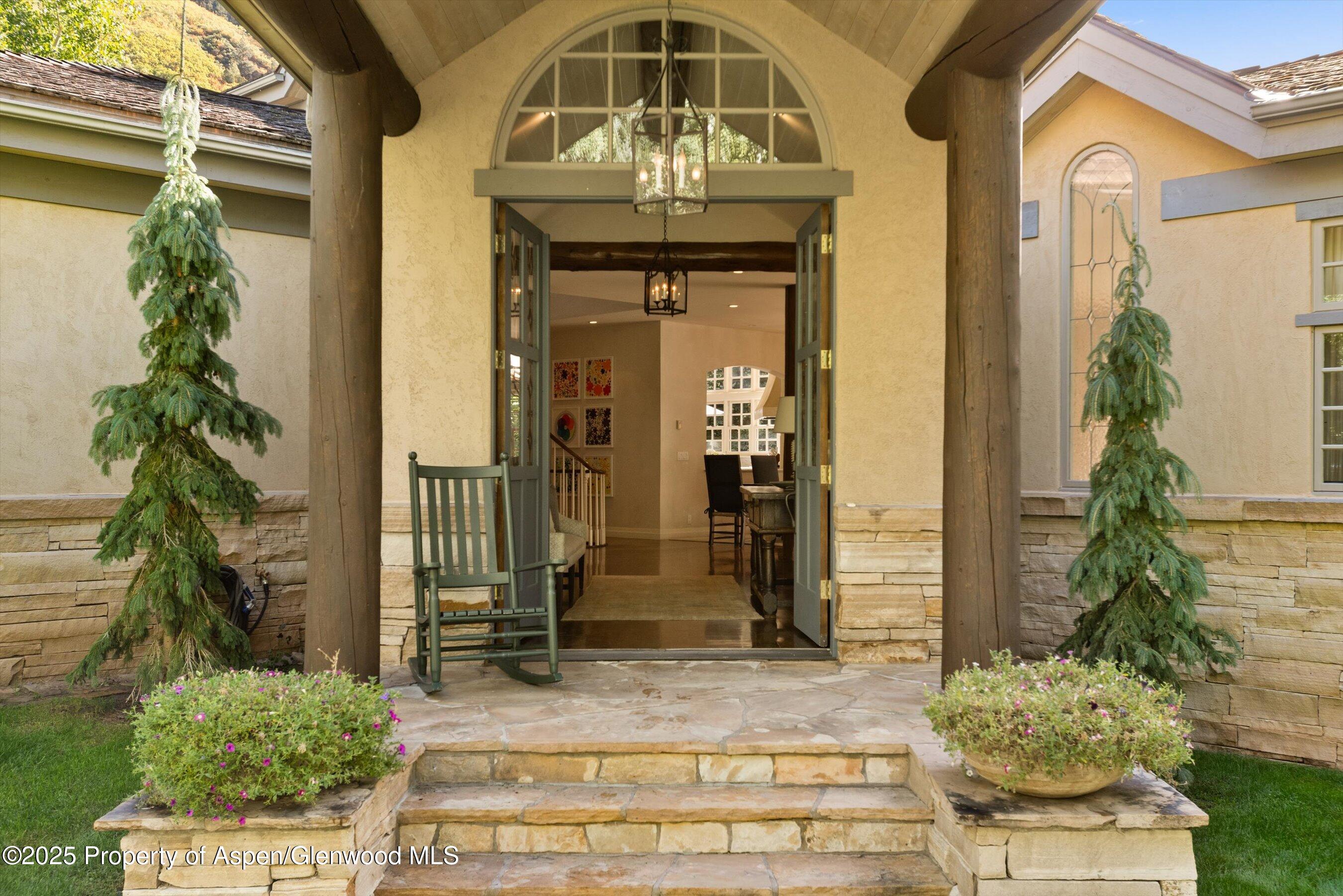 42 Northway Drive Aspen, CO 81611 - Photo 37 of 37 a front view of a house with a garden