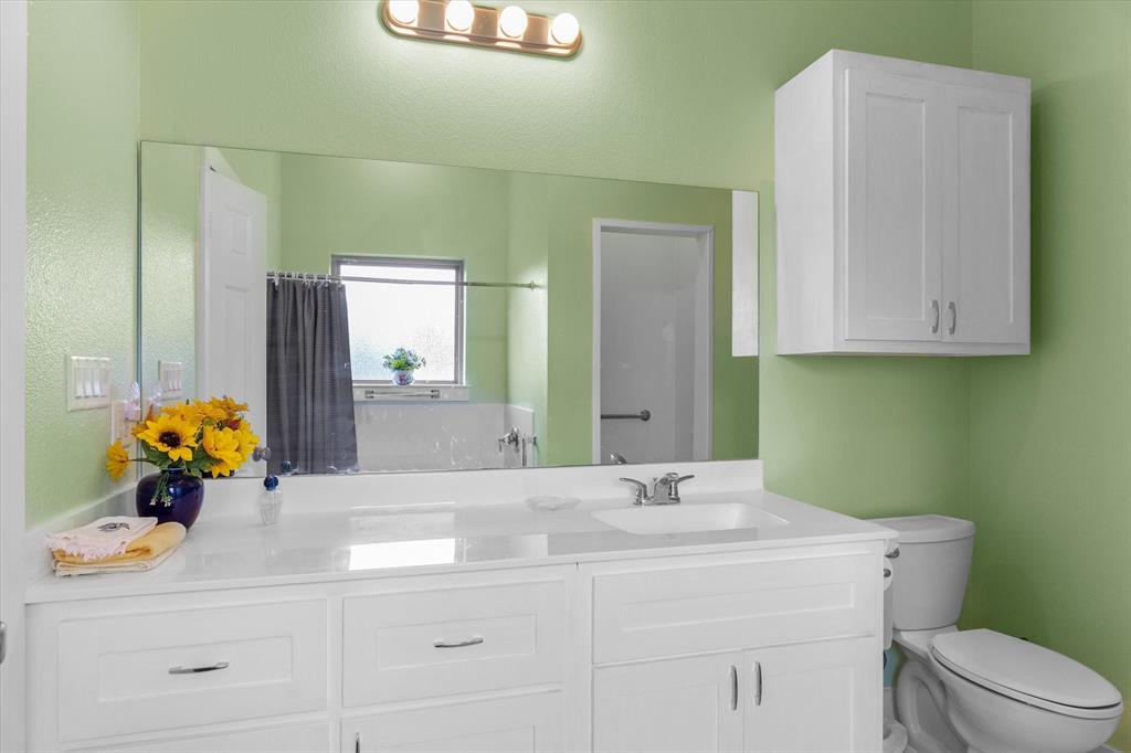 1461 B VZ County Road Ben Wheeler, TX 75754 - Photo 12 of 40 a bathroom with a sink toilet and mirror