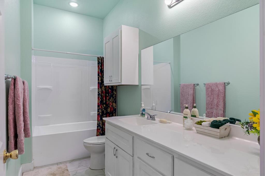 1461 B VZ County Road Ben Wheeler, TX 75754 - Photo 29 of 40 a bathroom with a double vanity sink toilet and shower