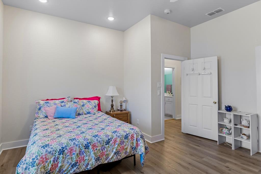 1461 B VZ County Road Ben Wheeler, TX 75754 - Photo 33 of 40 a bedroom with a bed and wooden floor