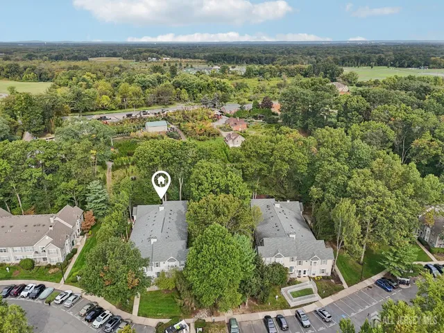 an aerial view of a house with a garden