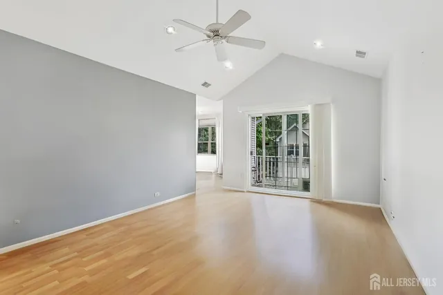 a view of an empty room with a window