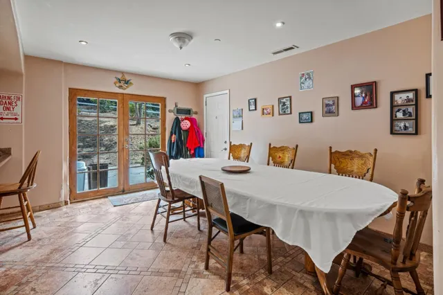 a room with a bed a couch and a window