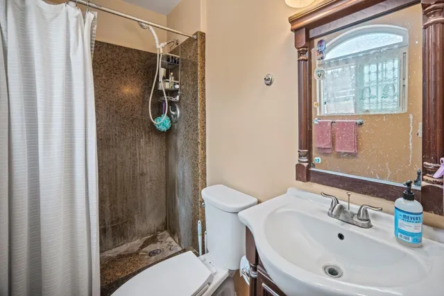 a view of a livingroom with furniture and a flat screen tv