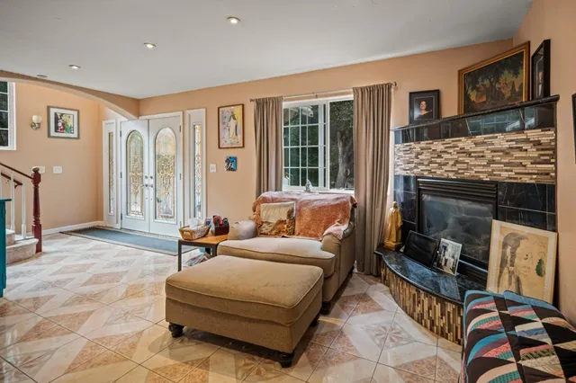 a bedroom with furniture and a fireplace