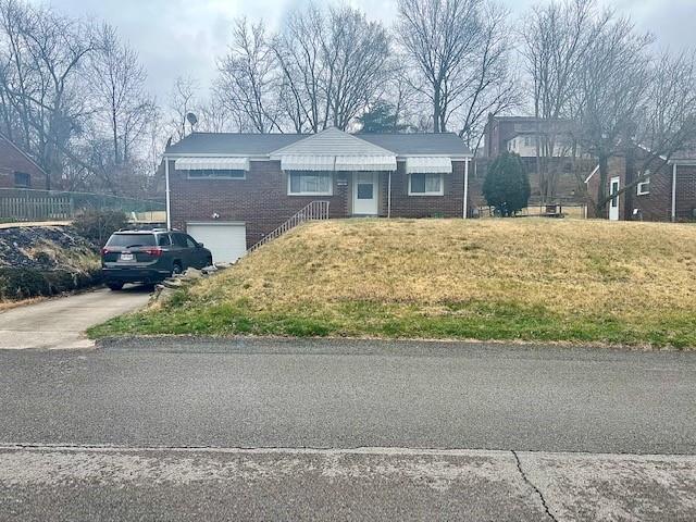 a front view of house with a yard