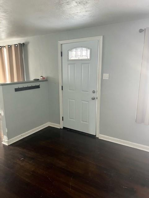 1040 5th Street Baden, PA 15005 - Photo 4 of 19 a view of an empty room with wooden floor and a window
