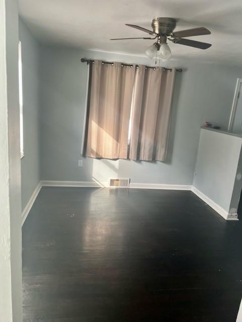 1040 5th Street Baden, PA 15005 - Photo 5 of 19 an empty room with wooden floor fan and windows