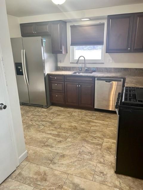 1040 5th Street Baden, PA 15005 - Photo 6 of 19 a kitchen with stainless steel appliances granite countertop a sink stove and refrigerator