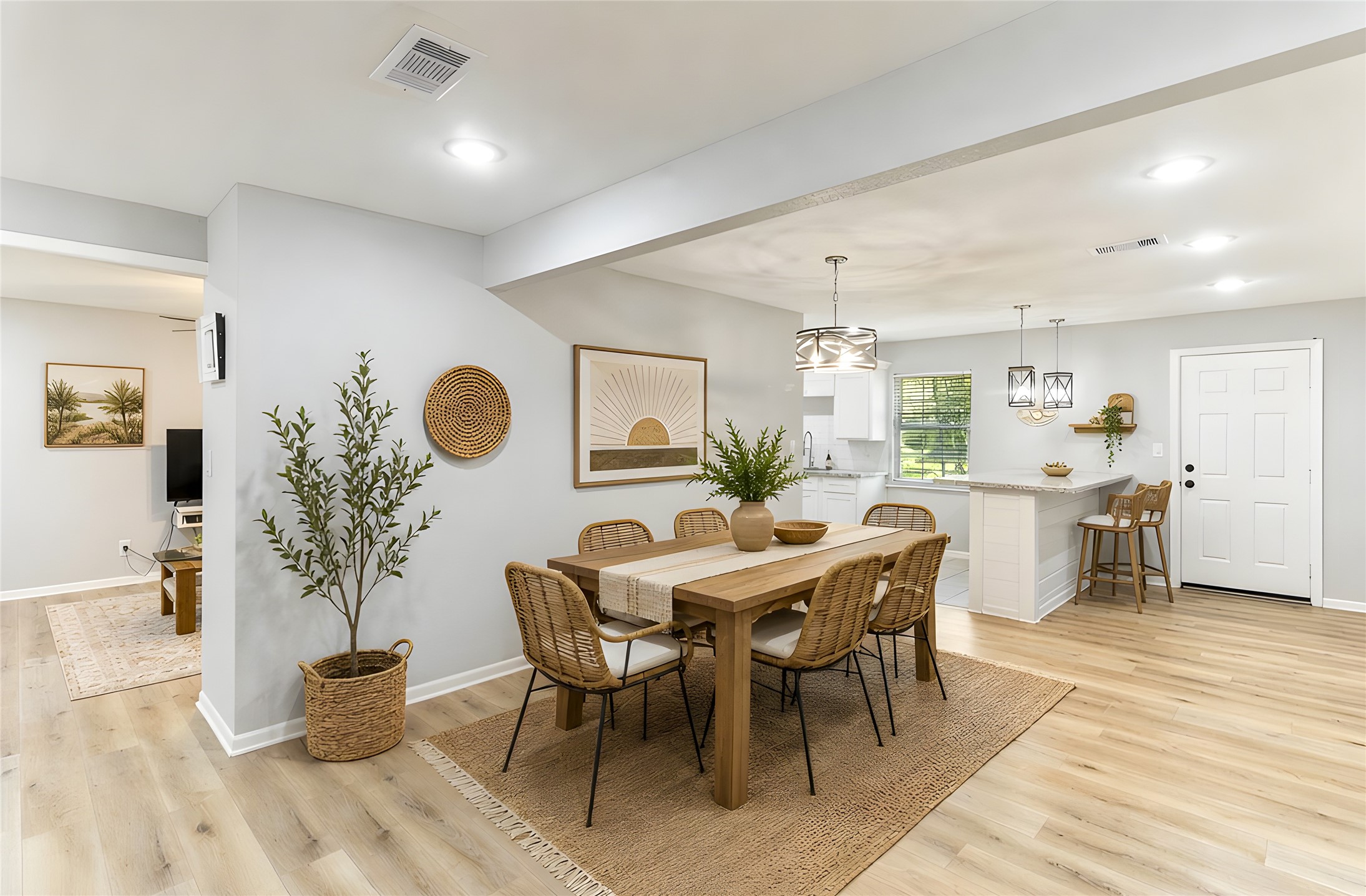 117 Cannon Street Clute, TX 77531 - Photo 7 of 24 Dining area (14x20) opens to the kitchen with updated flooring and bright neutral finishes.