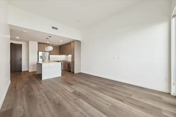 a view of kitchen with wooden floor