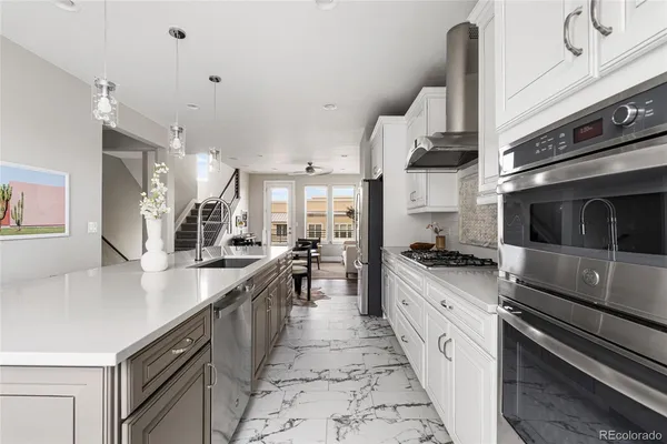 a stove top oven sitting inside of a kitchen