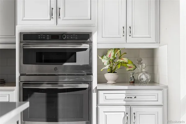 a view of a a dining room with furniture window and wooden floor