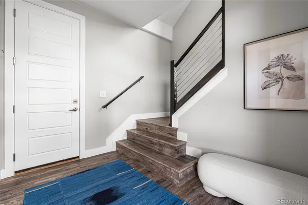 a view of entryway with wooden floor