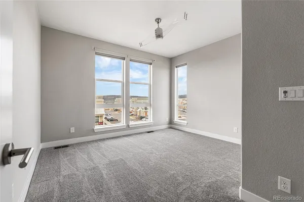 a view of an empty room with a bathroom