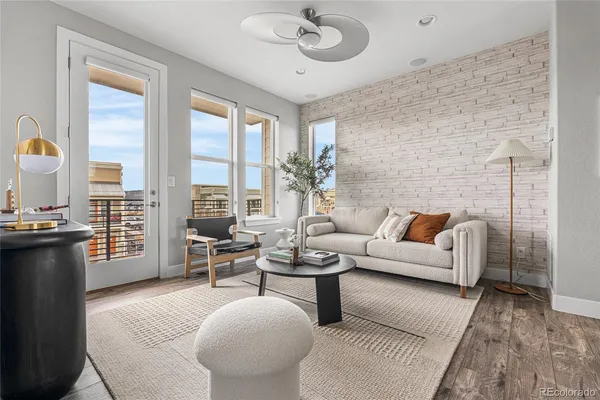 a kitchen with stainless steel appliances granite countertop a kitchen island a stove a table and chairs in it