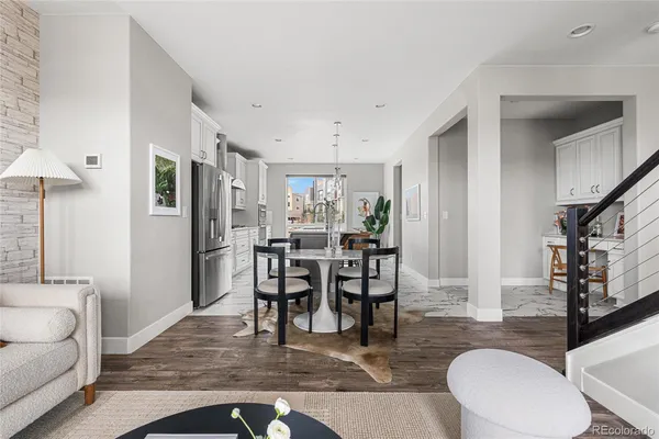 a view of a dining room with furniture window and wooden floor