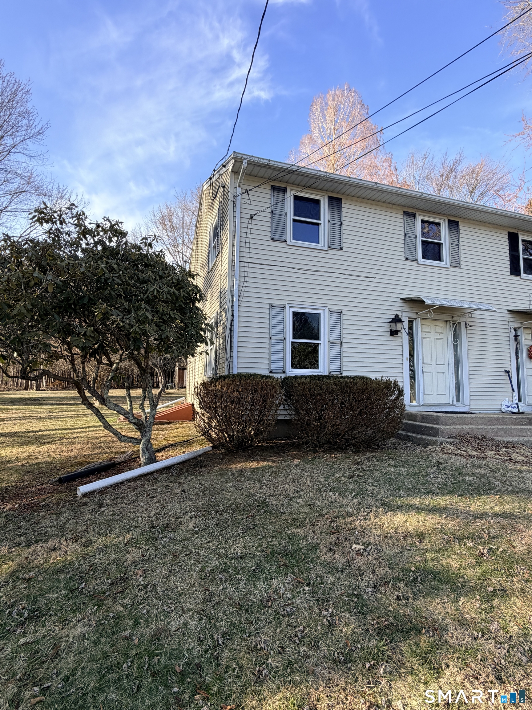 195 Wall Street Hebron, CT 06248 - Photo 2 of 23 a view of a house with a yard