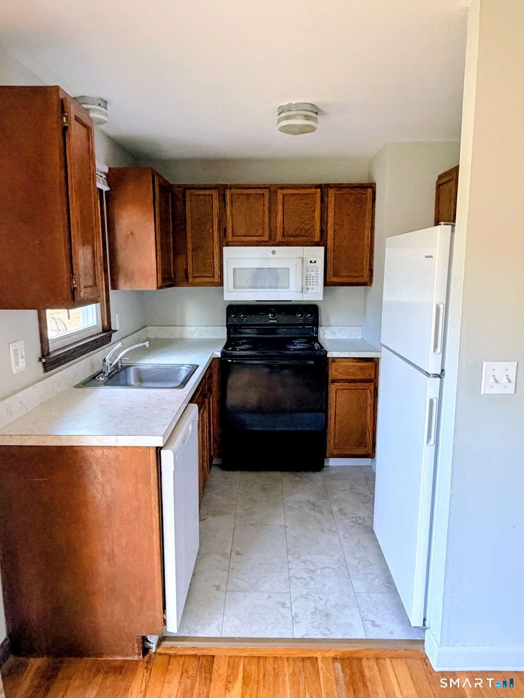 195 Wall Street Hebron, CT 06248 - Photo 3 of 23 a kitchen with a refrigerator sink and stove