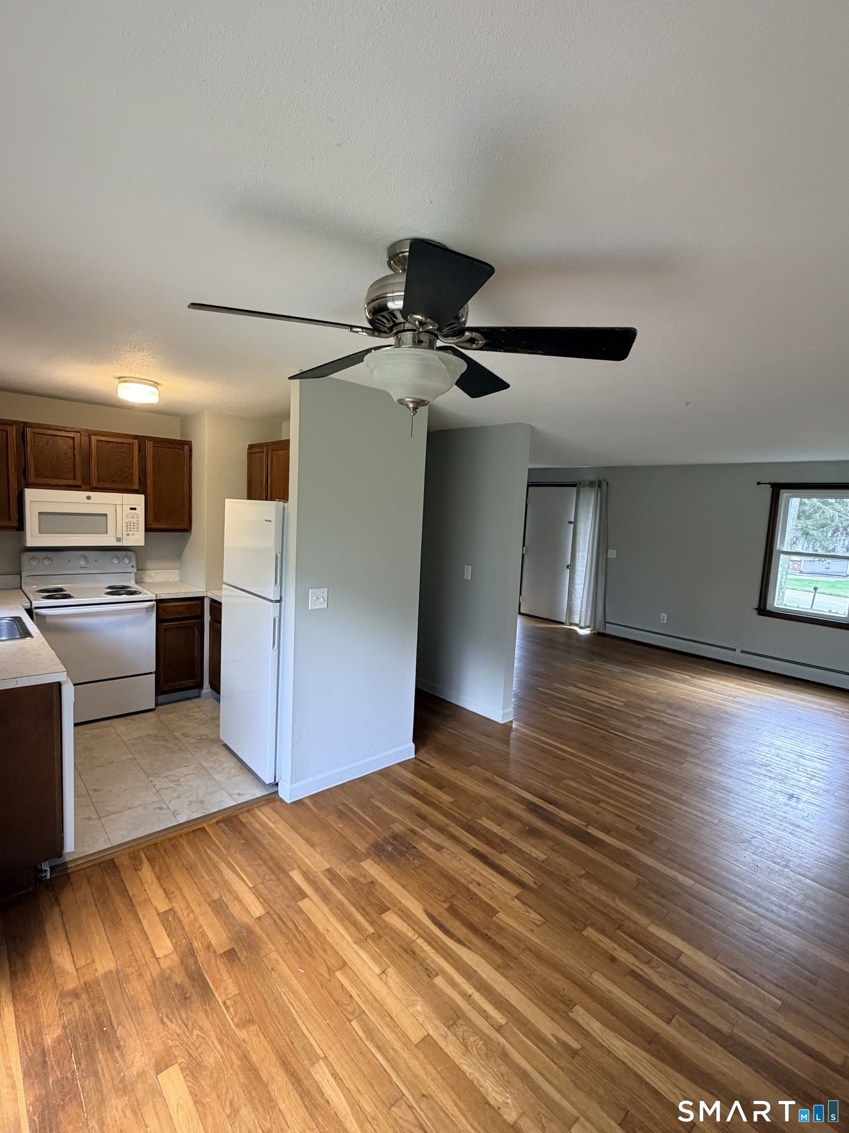 195 Wall Street Hebron, CT 06248 - Photo 8 of 23 a view of kitchen with sink microwave and refrigerator