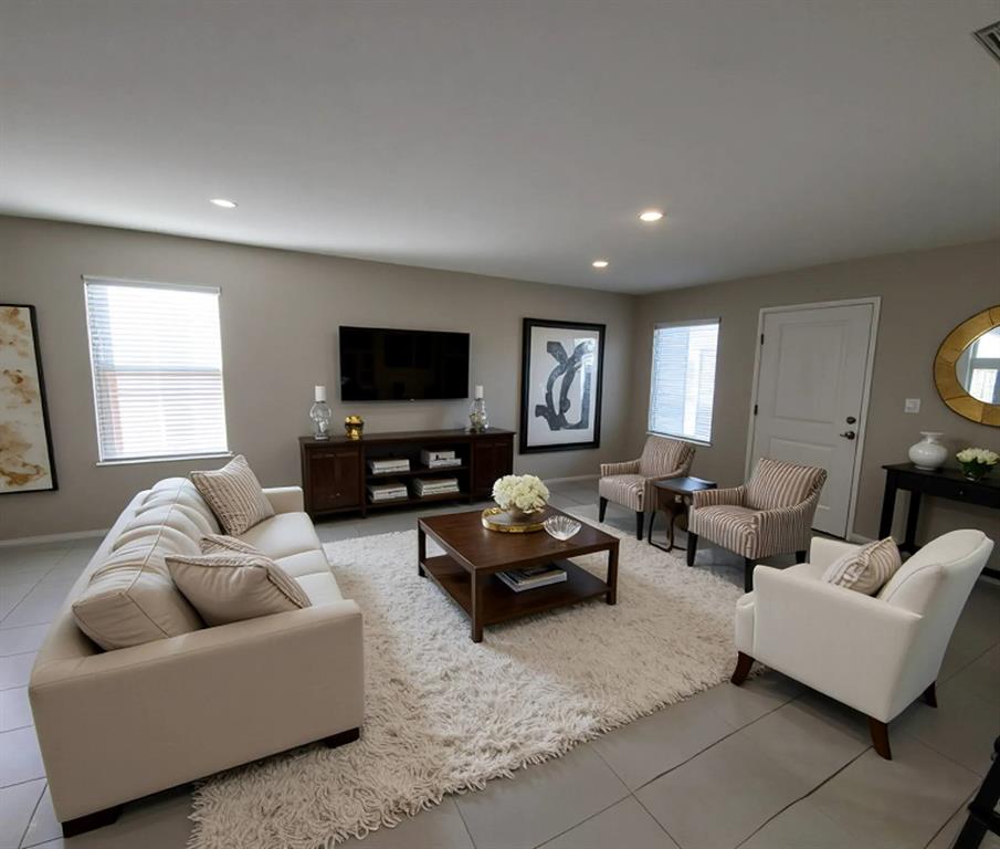 6087 Determine Lane Forney, TX 75126 - Photo 2 of 14 Living area with light tile patterned floors and recessed lighting