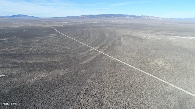 a view of an ocean and a mountain