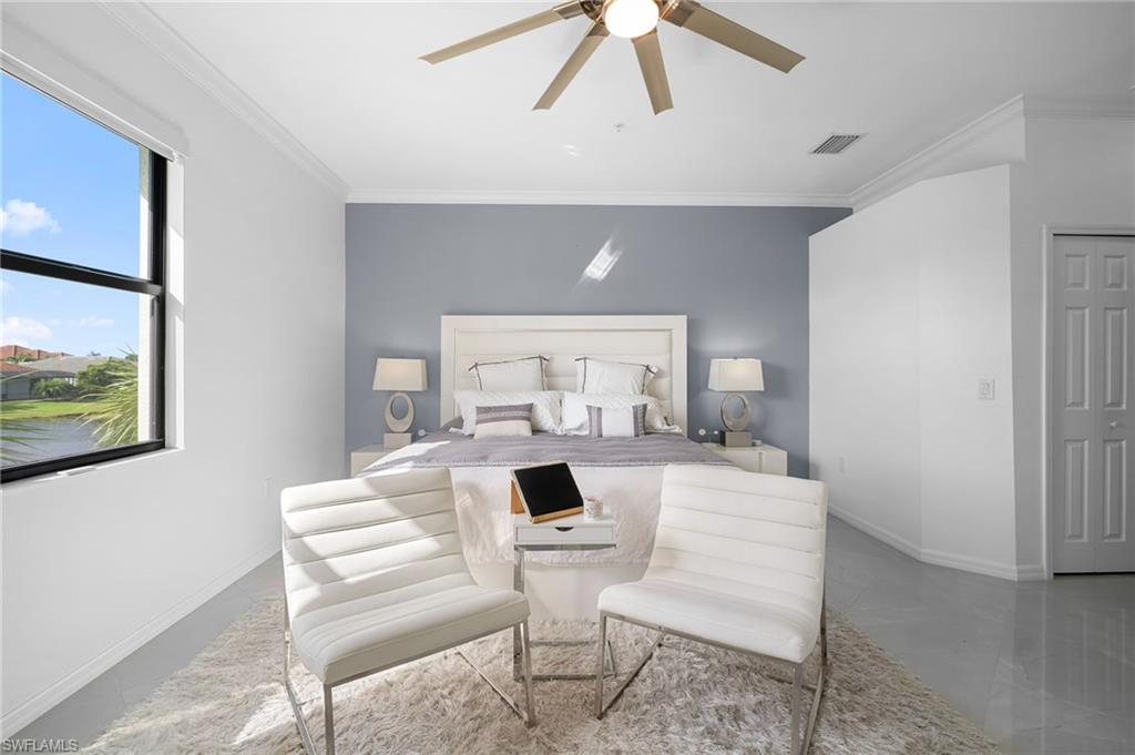 11879 Arboretum Run Drive, Unit 201 Fort Myers, FL 33913 - Photo 25 of 37 Bedroom featuring crown molding and ceiling fan
