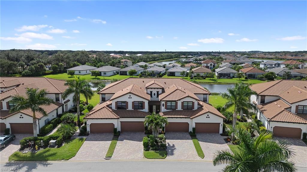 11879 Arboretum Run Drive, Unit 201 Fort Myers, FL 33913 - Photo 35 of 37 Aerial perspective of suburban area with a large body of water