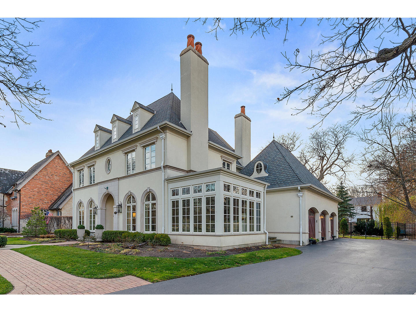 728 Cleveland Road Hinsdale, IL 60521 - Photo 2 of 35 a view of a white house with a big yard and large trees