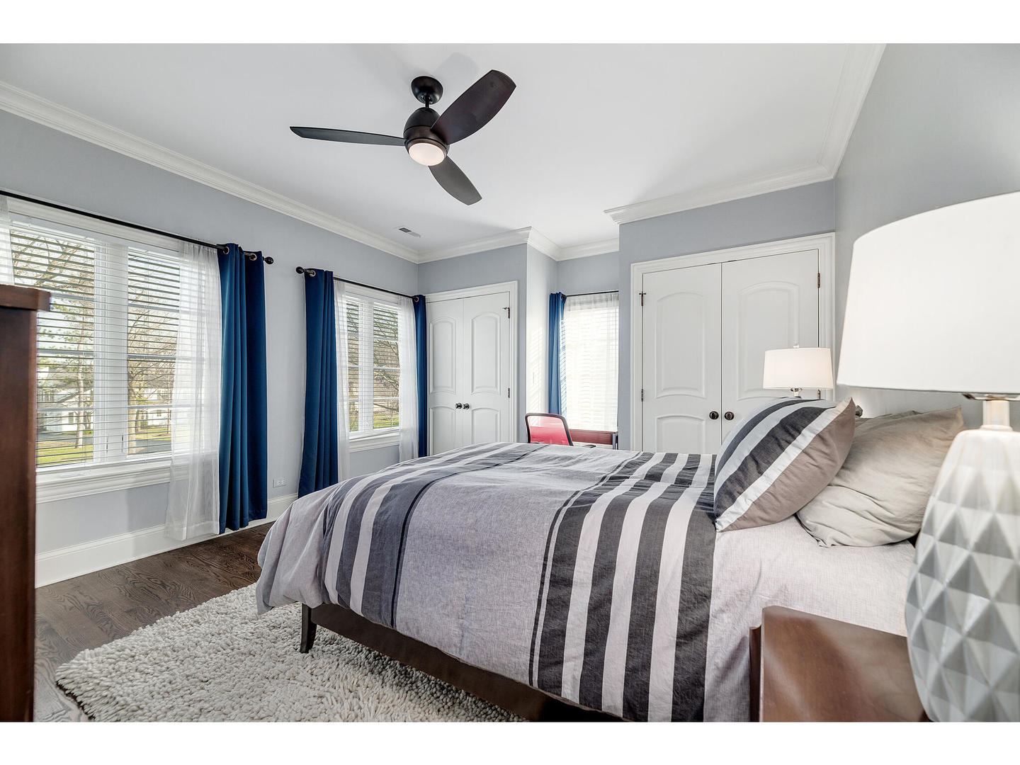 728 Cleveland Road Hinsdale, IL 60521 - Photo 23 of 35 a bed room with a bed and a chandelier