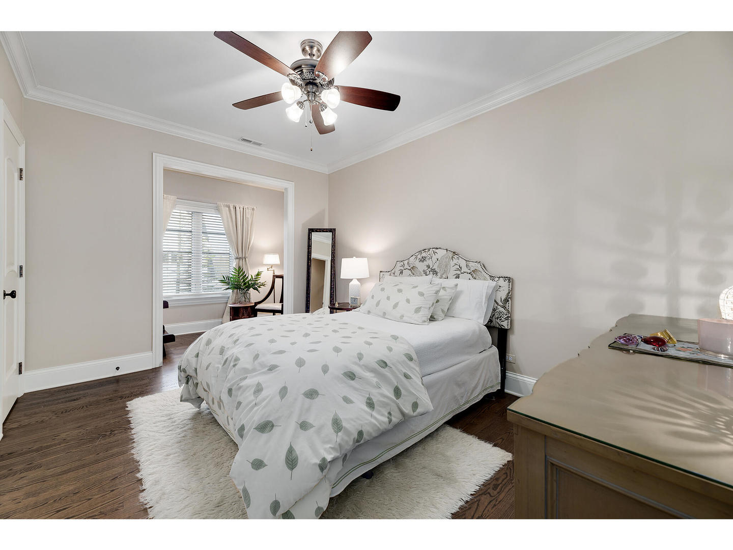 728 Cleveland Road Hinsdale, IL 60521 - Photo 24 of 35 a bedroom with a bed and wooden floor