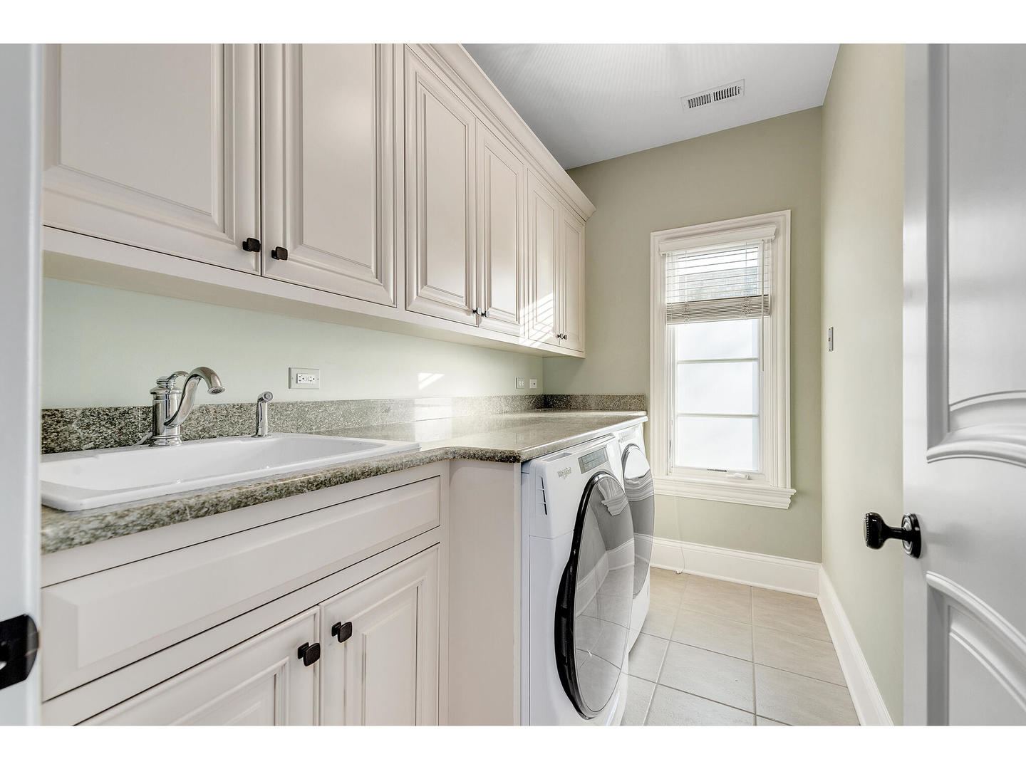 728 Cleveland Road Hinsdale, IL 60521 - Photo 26 of 35 a kitchen with granite countertop a sink and cabinets
