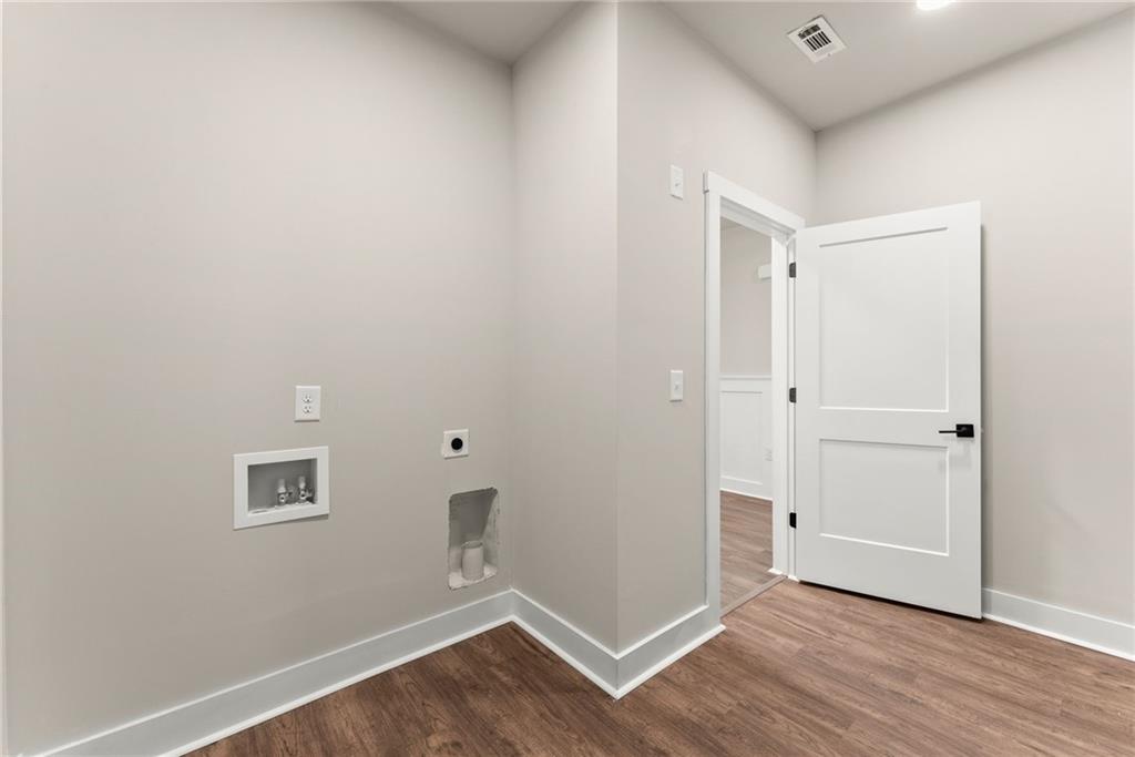 43 Anderson Street Jefferson, GA 30549 - Photo 29 of 45 a view of an empty room with wooden floor