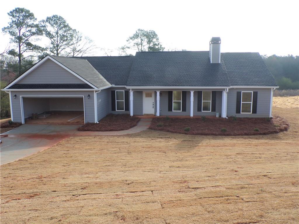 a front view of a house with yard