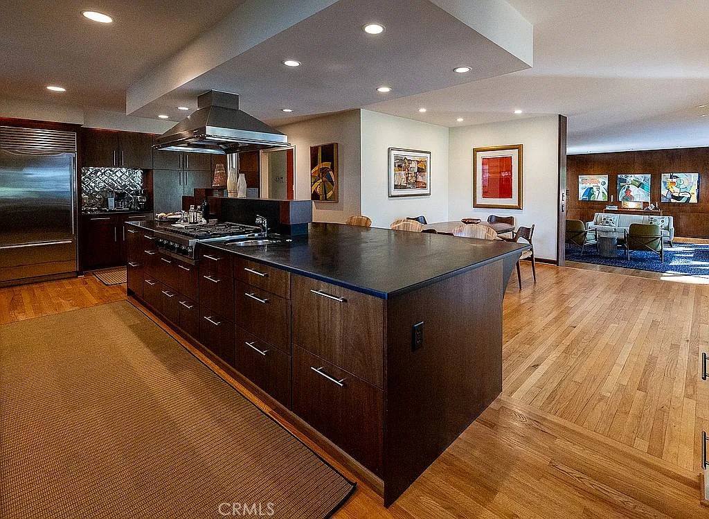 2751 Toxey Drive Raleigh, NC 27609 - Photo 16 of 41 a kitchen with stainless steel appliances granite countertop a sink a stove and a wooden floors