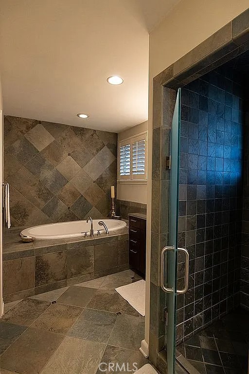 2751 Toxey Drive Raleigh, NC 27609 - Photo 25 of 41 a bathroom with a granite countertop bathtub and shower